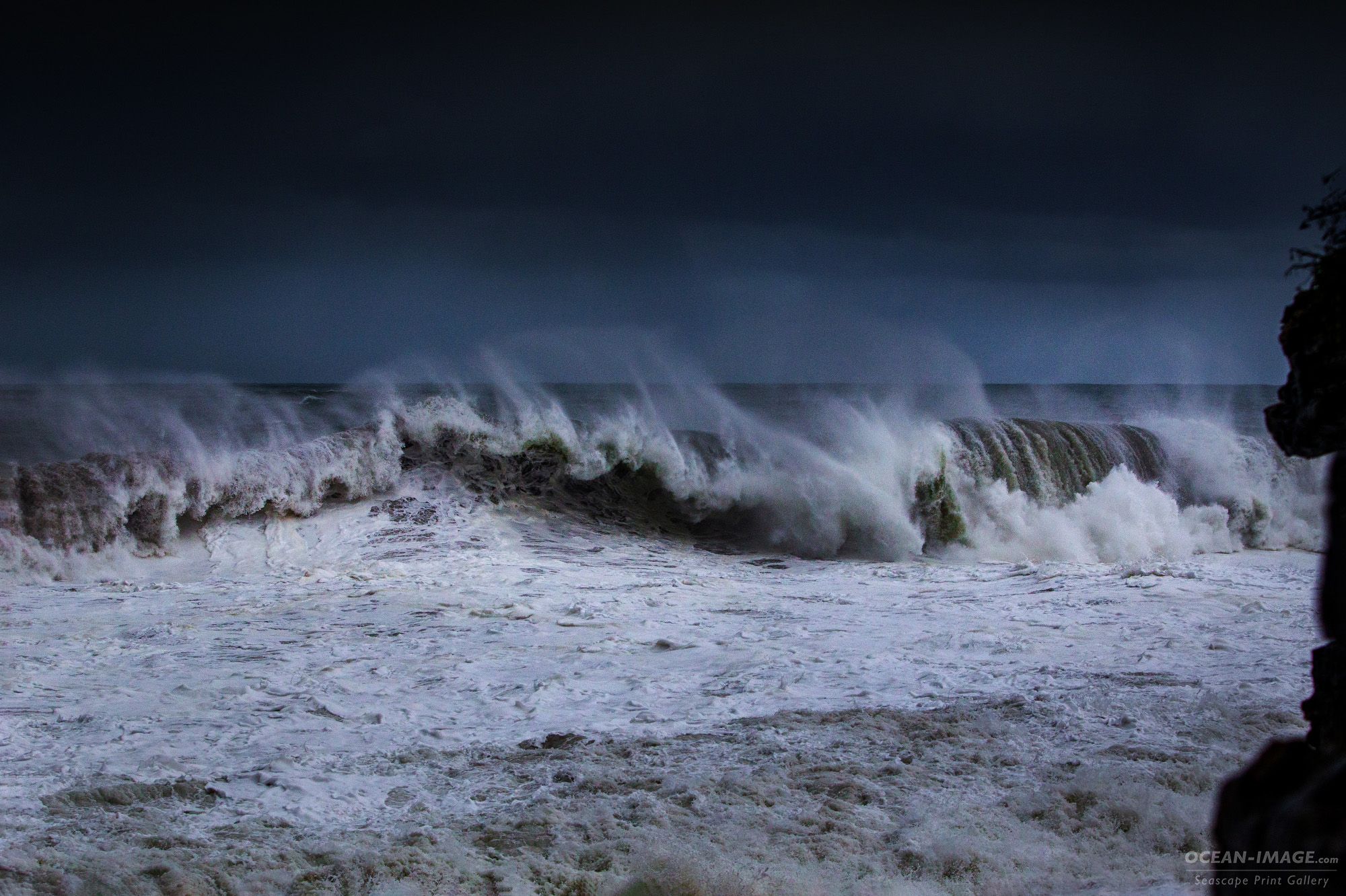 A heavy storm wave breaks on a Cornish shore
