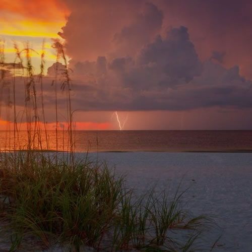 1st_Place_Sunset_and_a_little_lightning_close_out_a_very_beautiful_day_on_St._Pete_Beach_in_Florida_by_Josh_Herrington_PicsTa