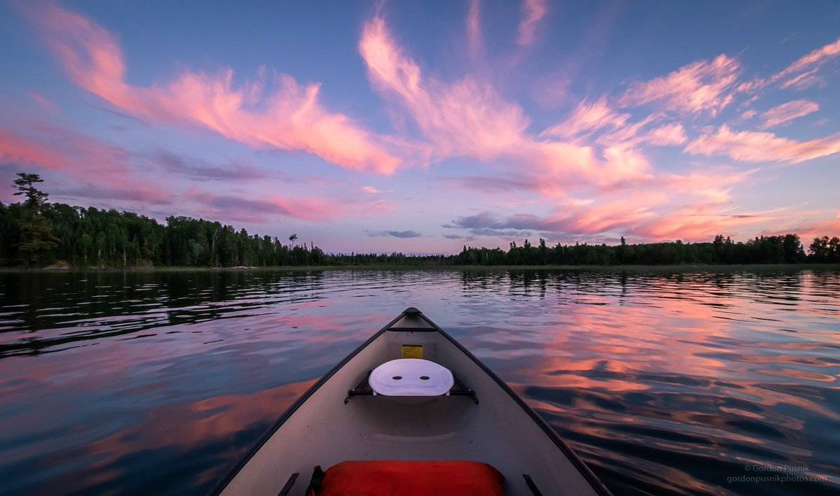 2nd Place A nice evening paddling under the cotton candy clouds - Northwest Ontario. by Gordon Pusnik @gordonpusnik