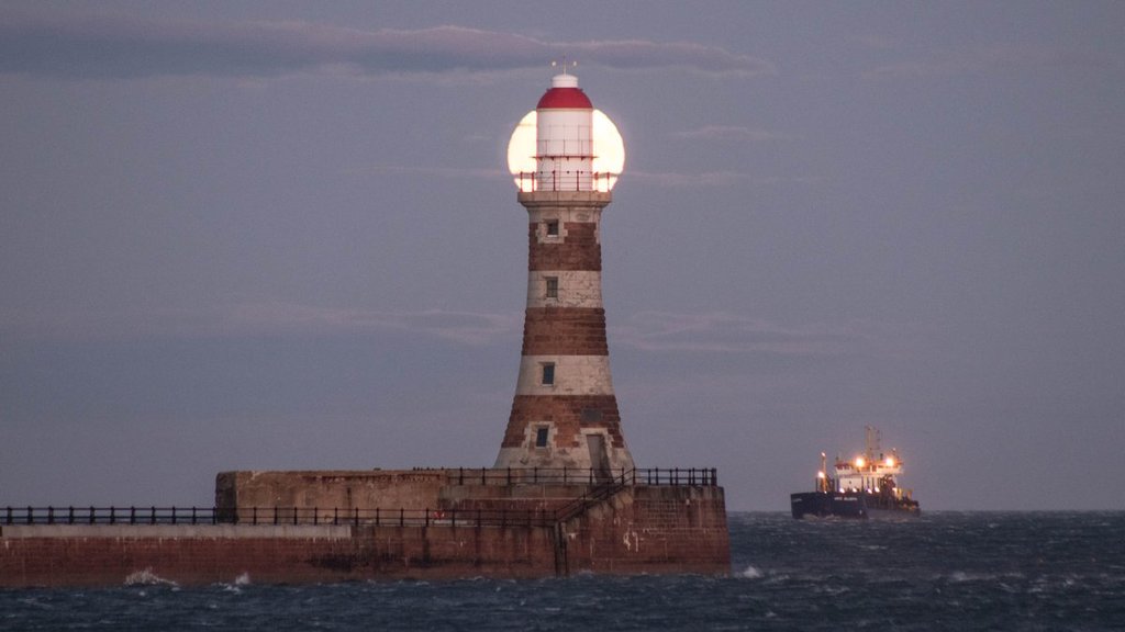 Roker_Lighthouse_choppy_seas_and_an_arriving_ship_by_simon_c_woodley_simoncwoodley_1024x1024