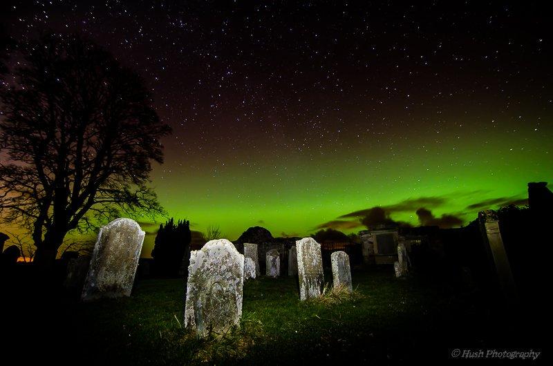 Aurora_borealis_creeping_through_the_Old_Preston_Road_graveyard_Scotland_by_Grimm_grimm_banks_1024x1024