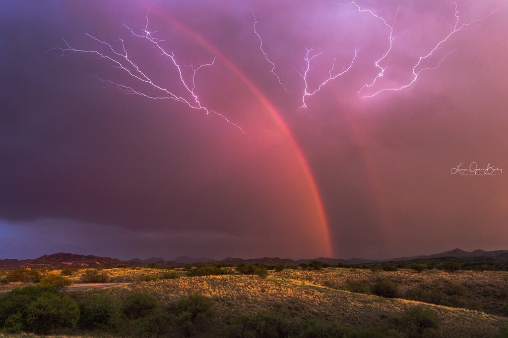 1st_Place_A_dying_storm_with_a_dazzling_double_rainbow_while_lightning_crawls_across_the_sky_last_week_near_Arivaca_AZ_by_Lori_Grace_Bailey_lorigraceaz_1024x1024