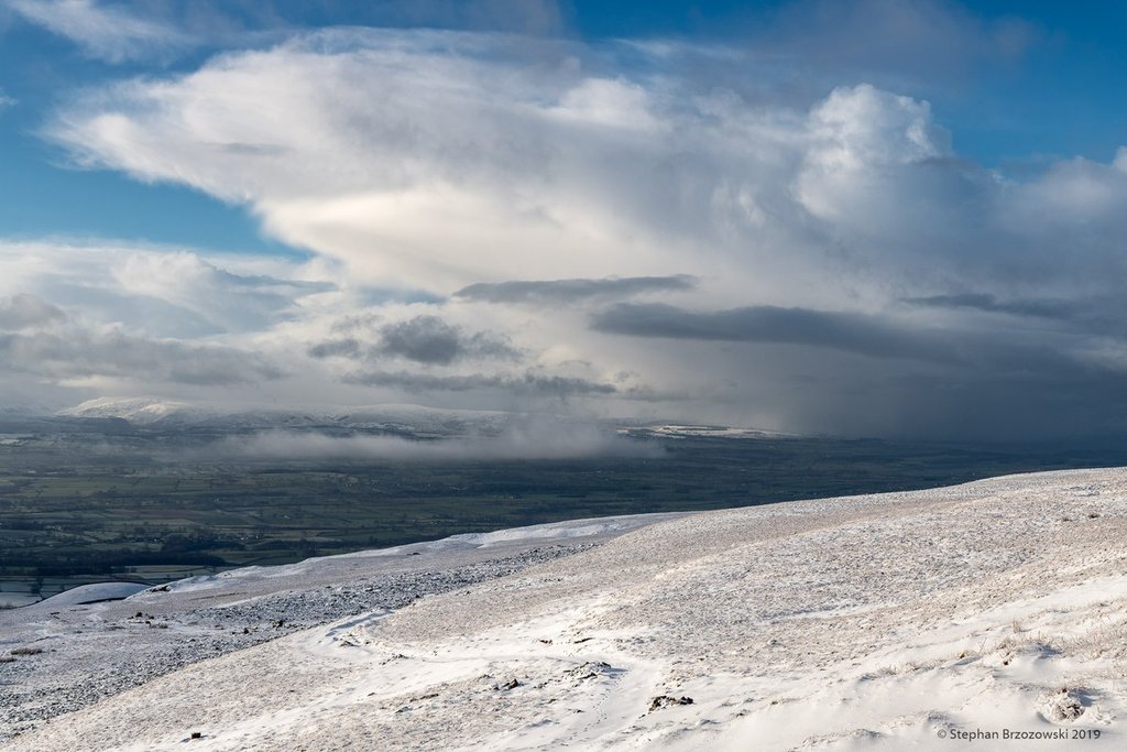 3rd_Place_Snow_shower_cloud_hovering_over_the_Eden_Valley_in_Cumbria_by_Stephan_Brzozowski_stephanbrz_1024x1024
