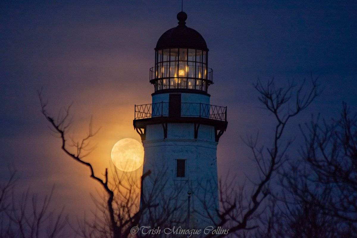 1st Place Full moon through Spring haze over Montauk Lighthouse, NY by Trish MinogueCollins @TrishMinogPhoto