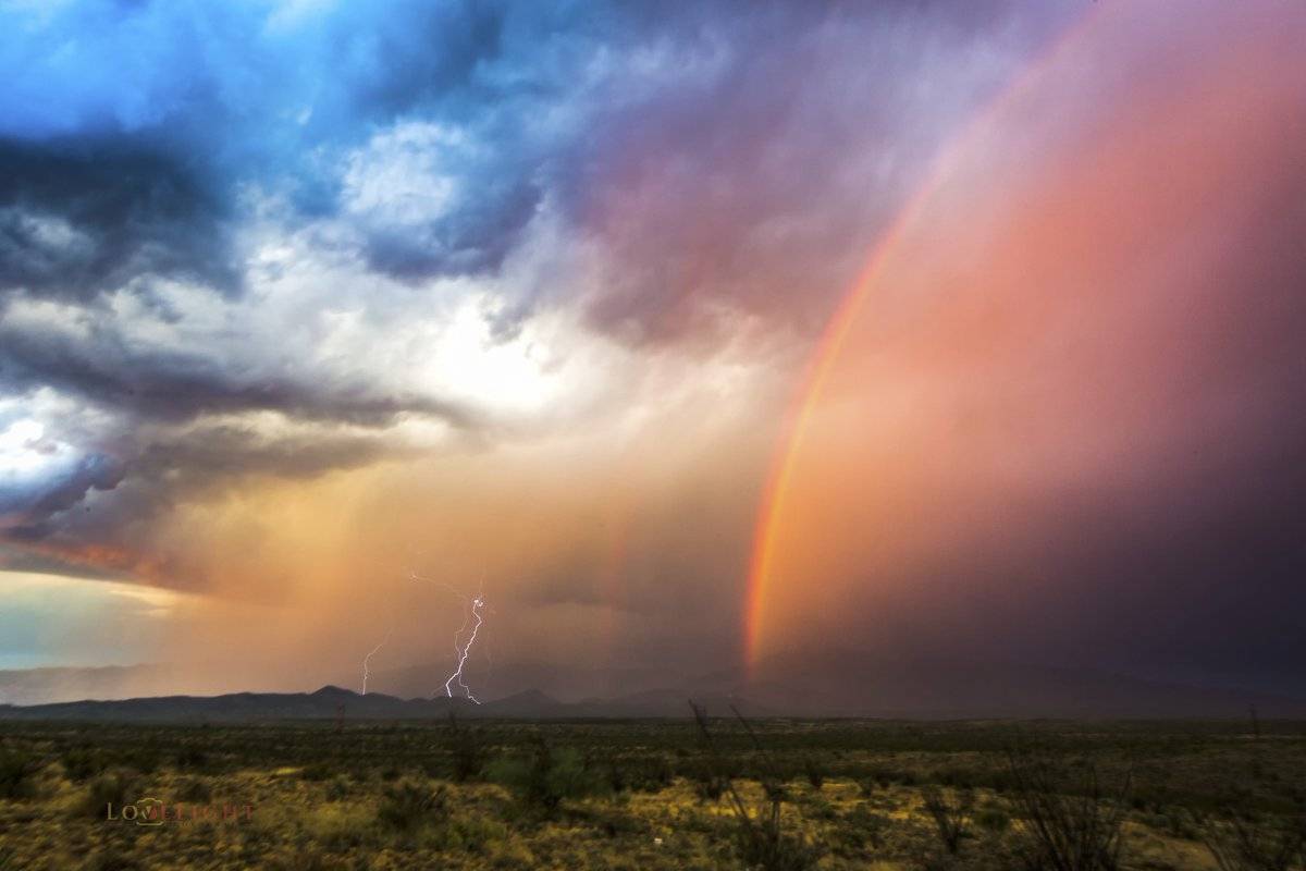 1st Place Lori Grace Bailey @lorigraceaz Epic dbl rainbow and CG lightning over the Rincon Mts E of Tucson, AZ!