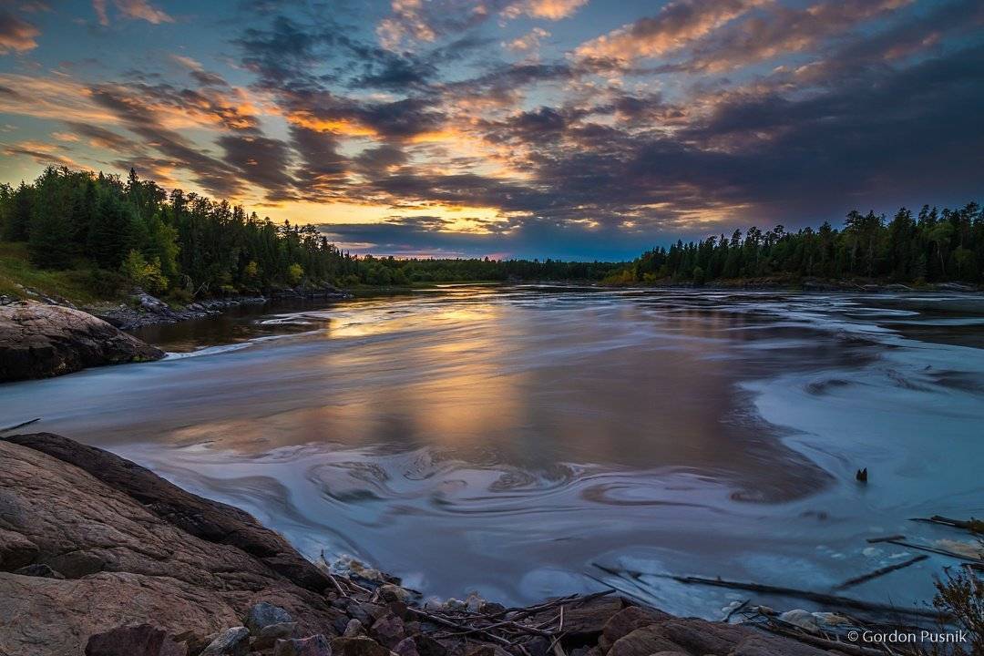 2nd Place Gordon Pusnik @gordonpusnik Sitting on a rock watching the water go by. N.W. Ontario.