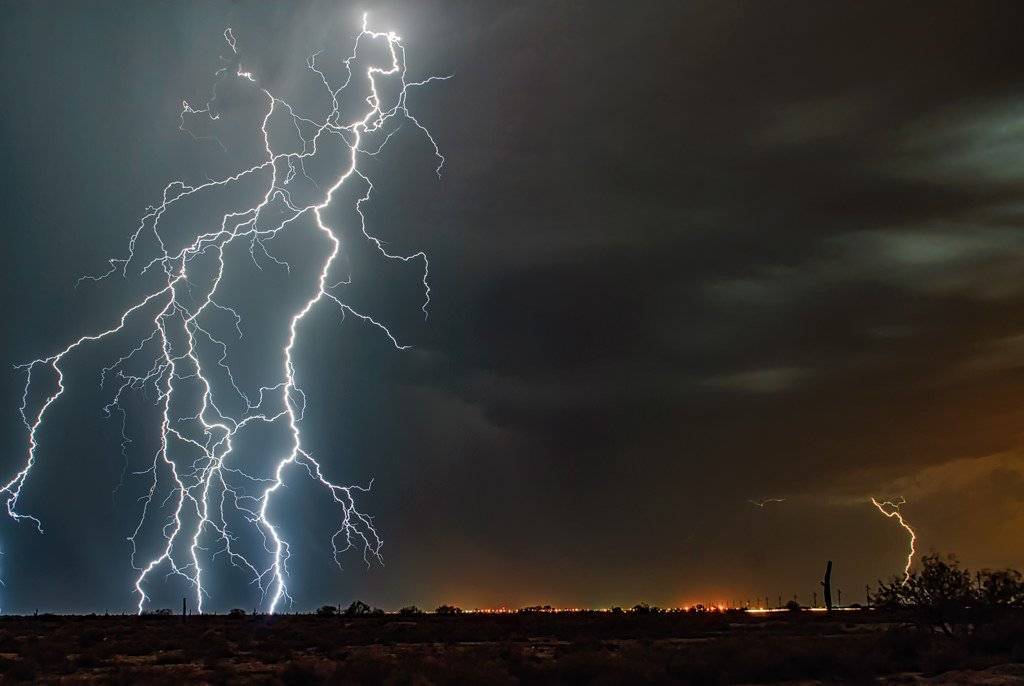 2nd Place Lightning striking south of Phoenix, looking north, during monsoon season by Scott Wood @Scott_Wood