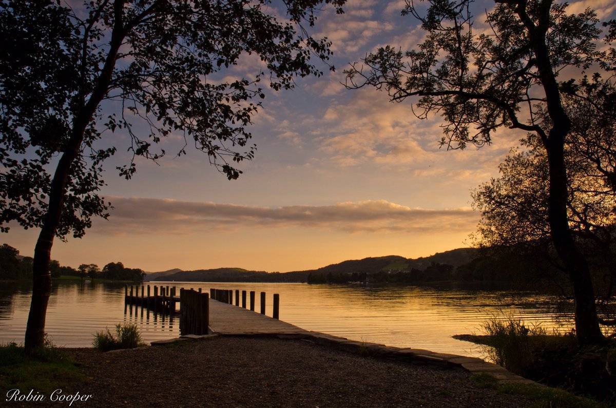 3rd Place Robin Cooper‏ @R3Cooper Waiting for the last boat home, by the light of the setting sun. Coniston Water