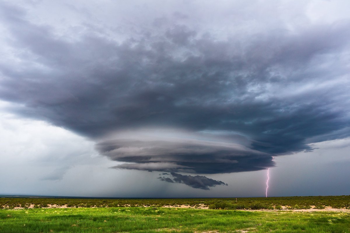 Lightning bolts in the desert near San Simon, Arizona by John Sirlin @SirlinJohn