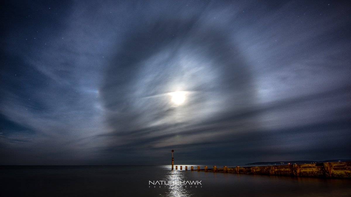 A fantastic lunar halo captured during a late night shoot on Bournemouth beach by Naturehawk Photo @NaturehawkPhoto