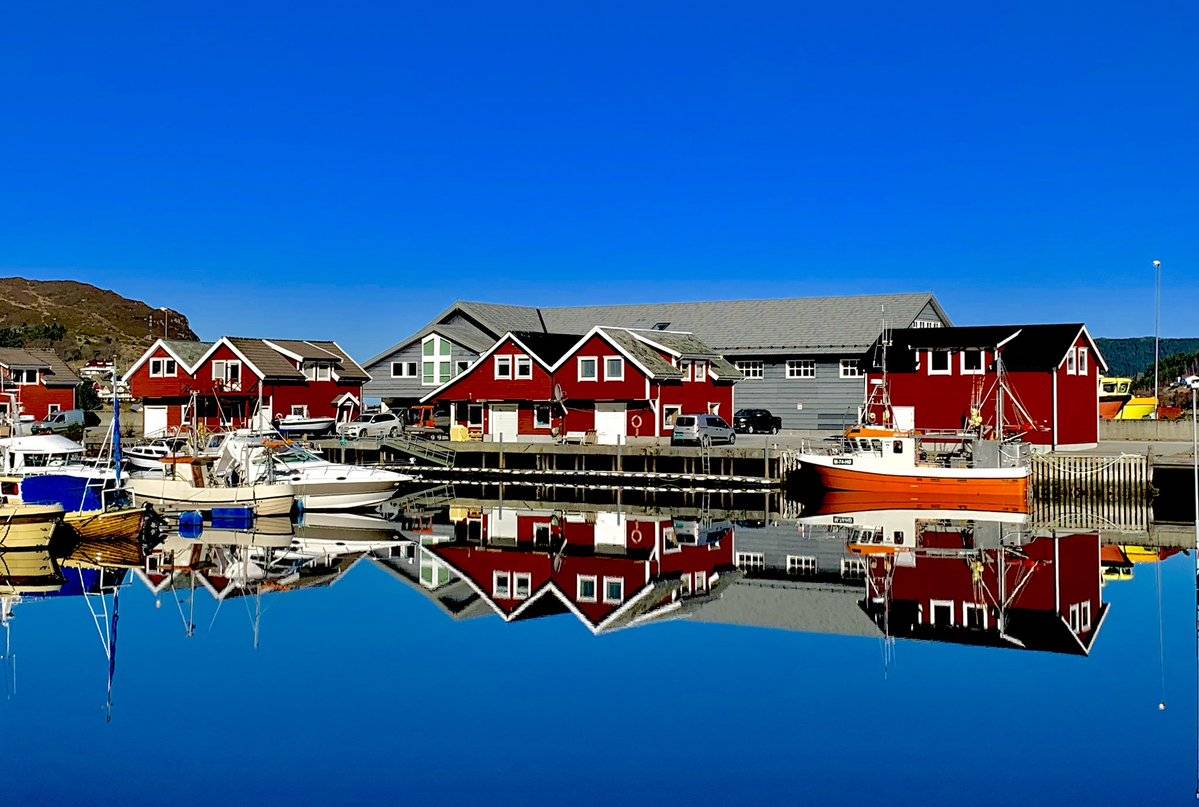 Crystal clear water with red boathouse in Norway by sirxxGray @bjornmgray