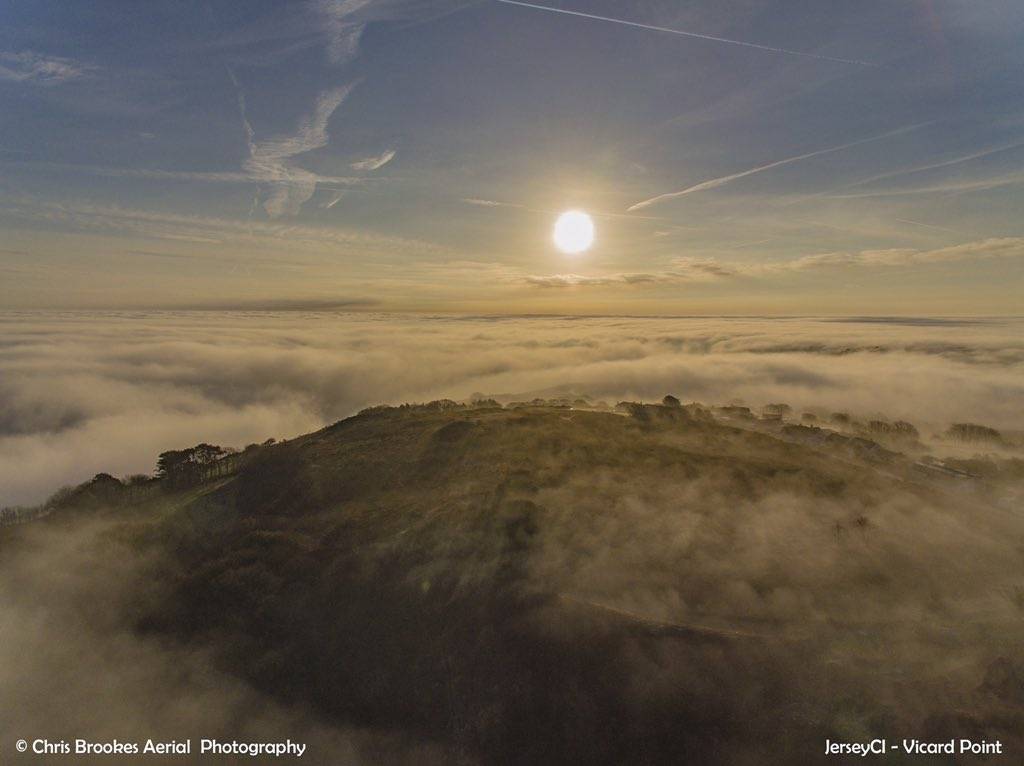 A sea of mist covering the north coast of Jersey, Channel Islands by Chris Brookes Aerial Photography @CBaerialphotos
