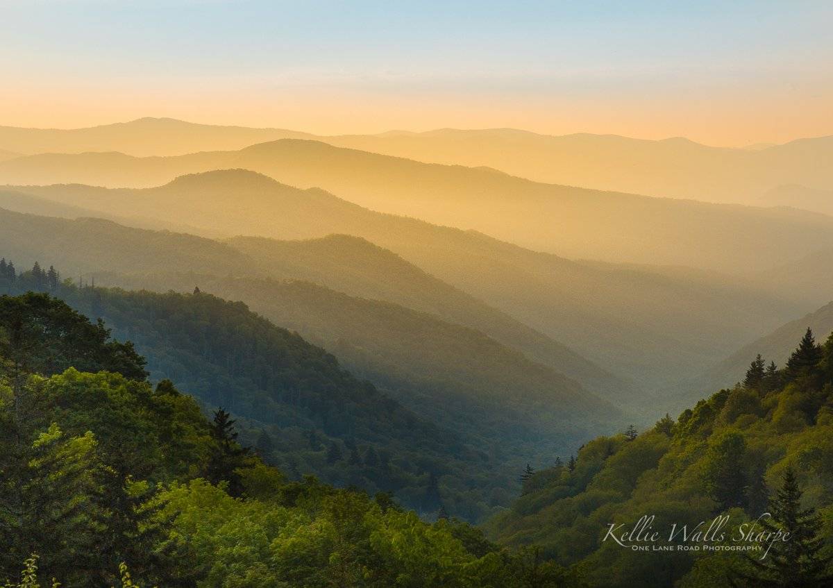 Light spilling down into the Oconaluftee River Valley at sunrise by OneLaneRoadPhotography @OneLanePhoto