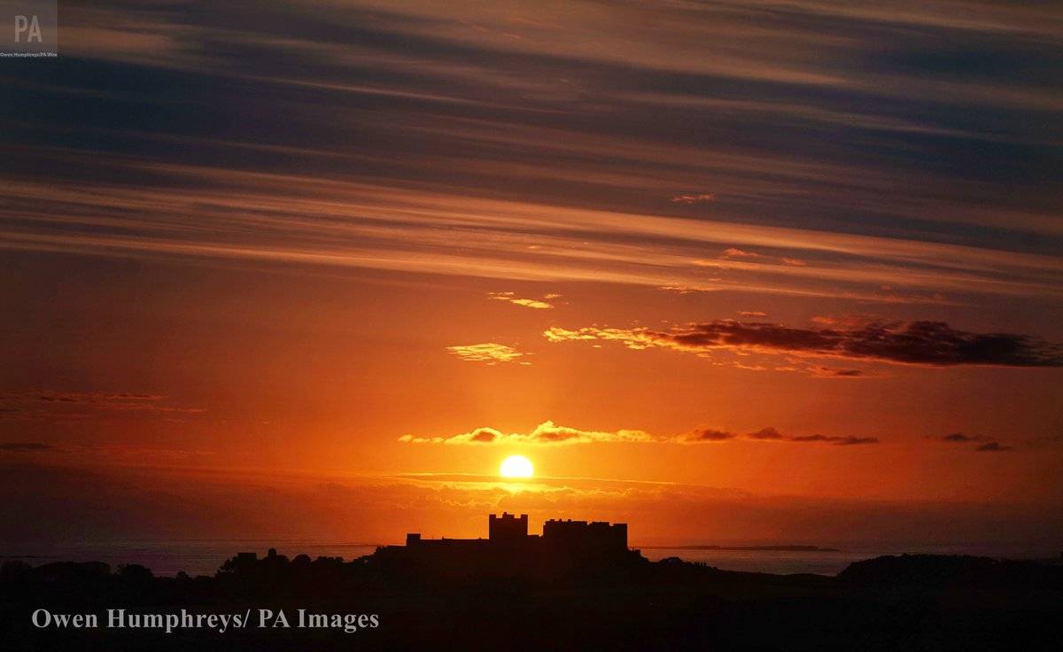 Sunrise at Bamburgh Castle in Northumberland by Owen Humphreys @owenhumphreys1