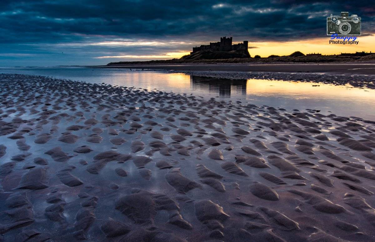 3rd Place Moody Bamburgh Sunrise by Coastal Portraits @johndefatkin 