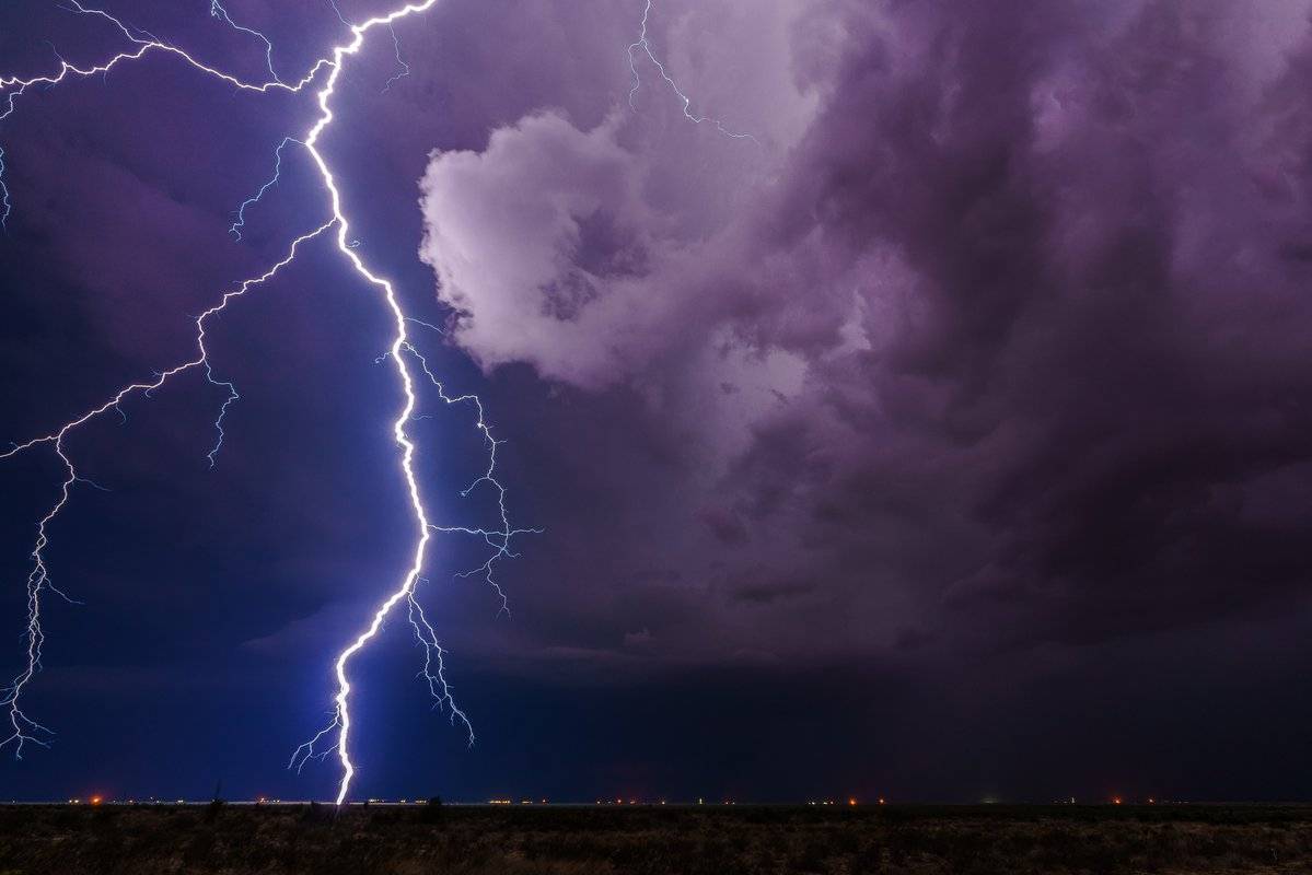 Positive lightning rains down over the oil fields north of Pecos, TX by Lori Grace Bailey @lorigraceaz