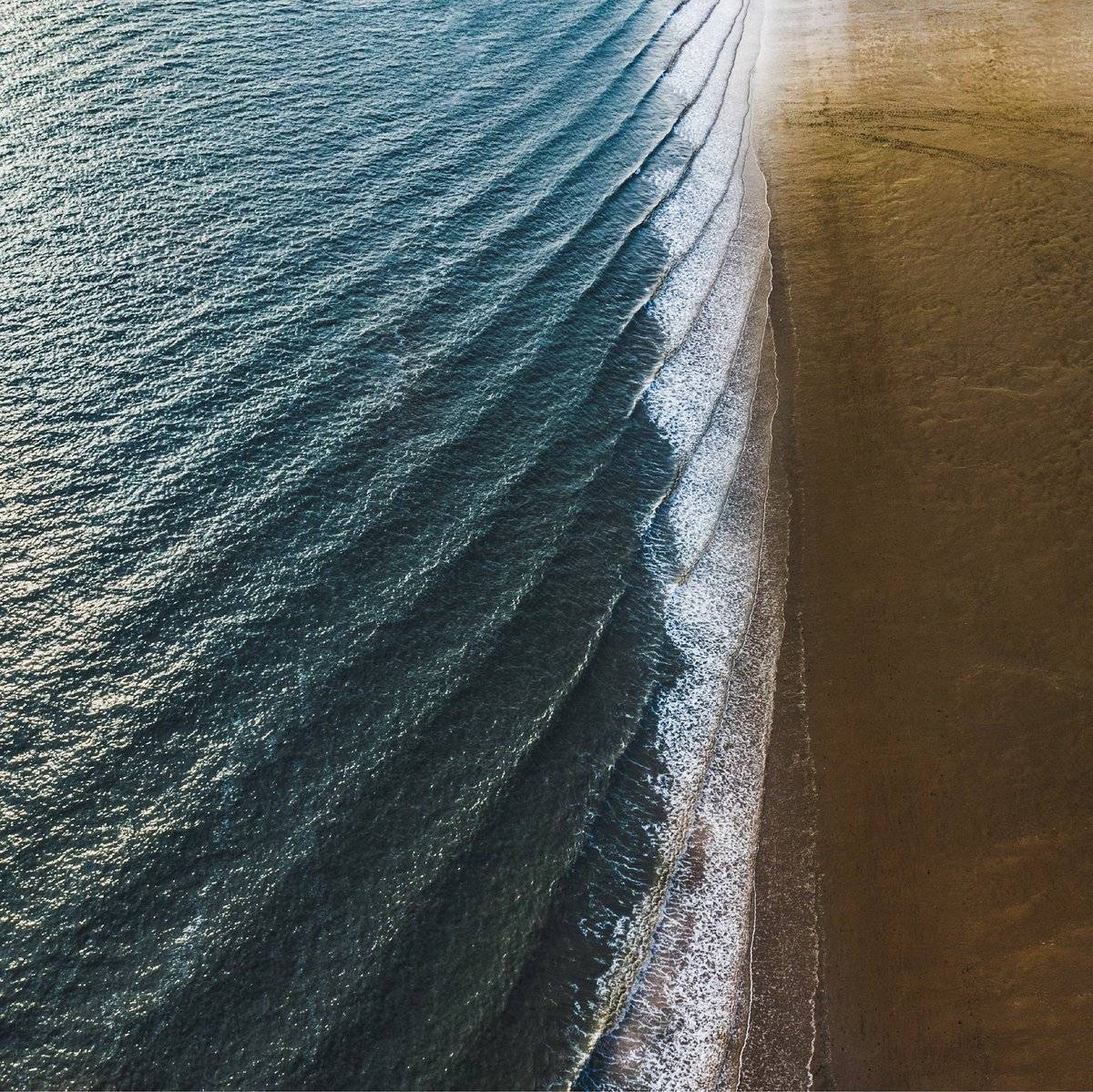 A shot of the slowly incoming tide at Crosby Beach at sunset by Neil @OnClearDaysUK