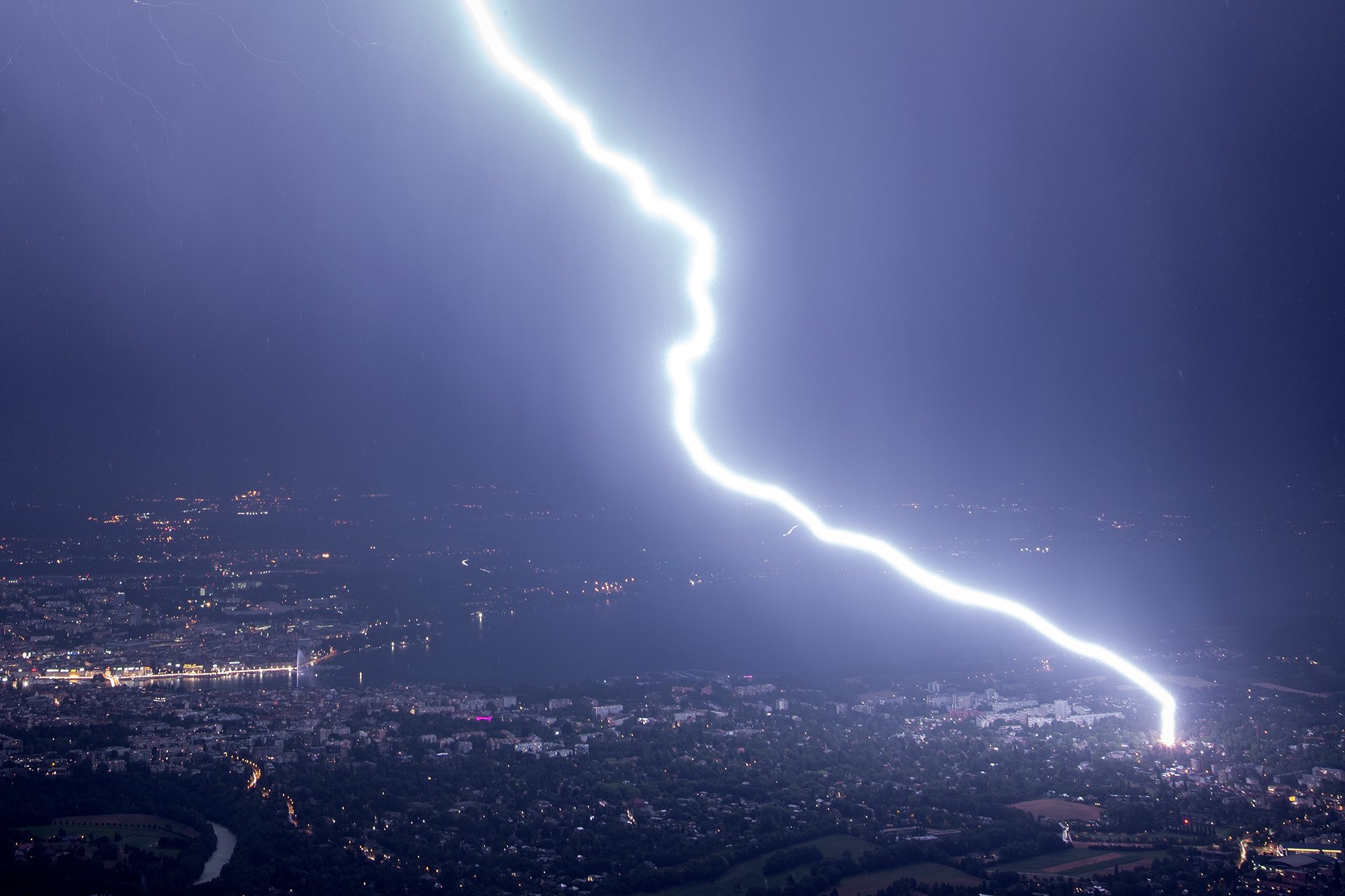 Positive lightning strike over Geneva by Christophe Suarez @suarezphoto