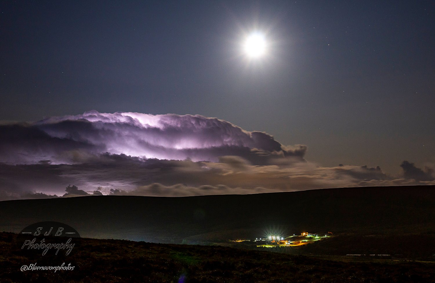 Saturn to the right of the Moon and a little lightning action in the clouds above Big Pit Museum by stuArt @Blaenavonphotos 