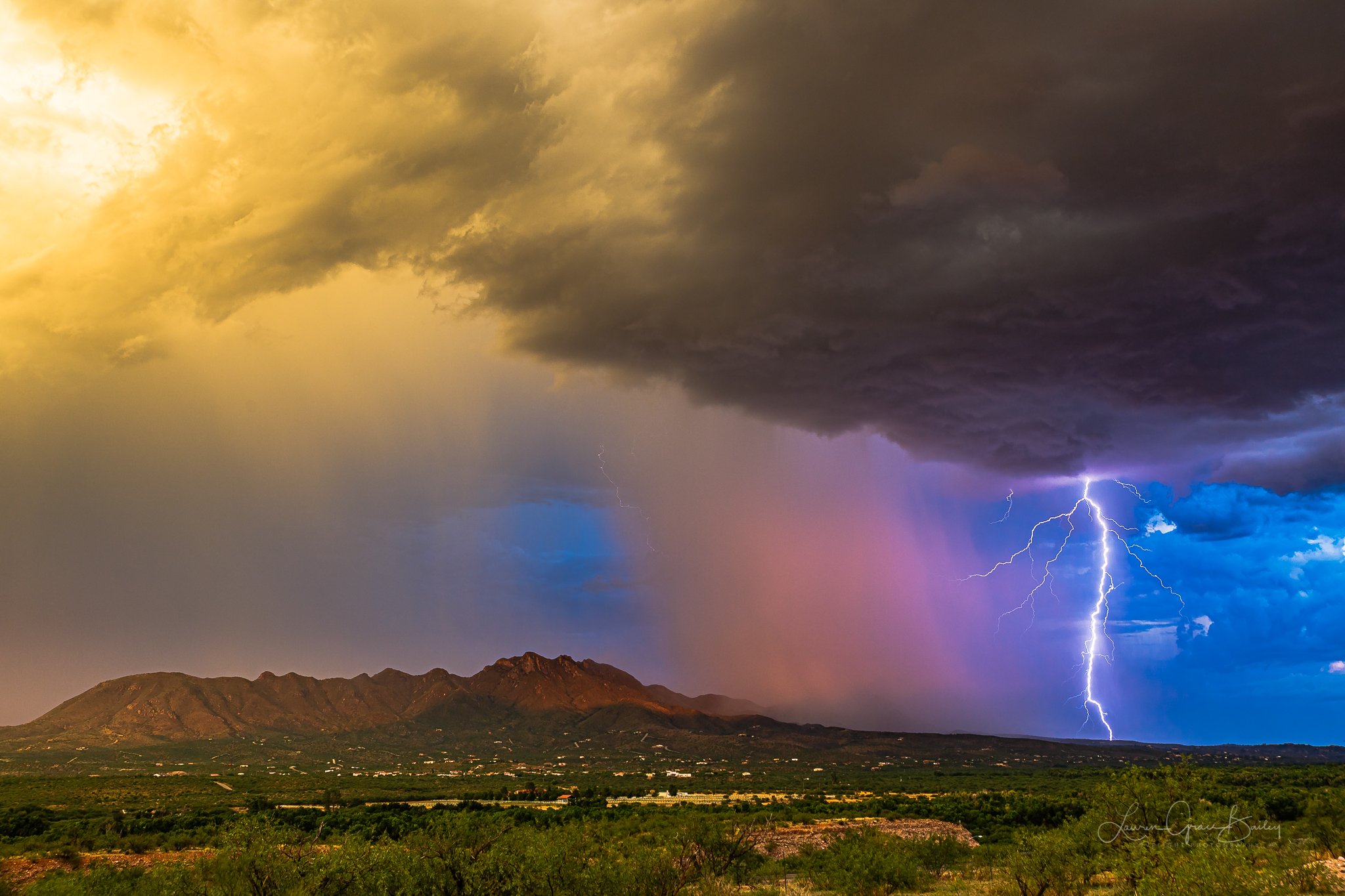 The monsoon in Arizona. Sunset colors, lightning, cloud structure, green valleys and mountain backdrops. Rio Rico. By Lori Grace Bailey @lorigraceaz