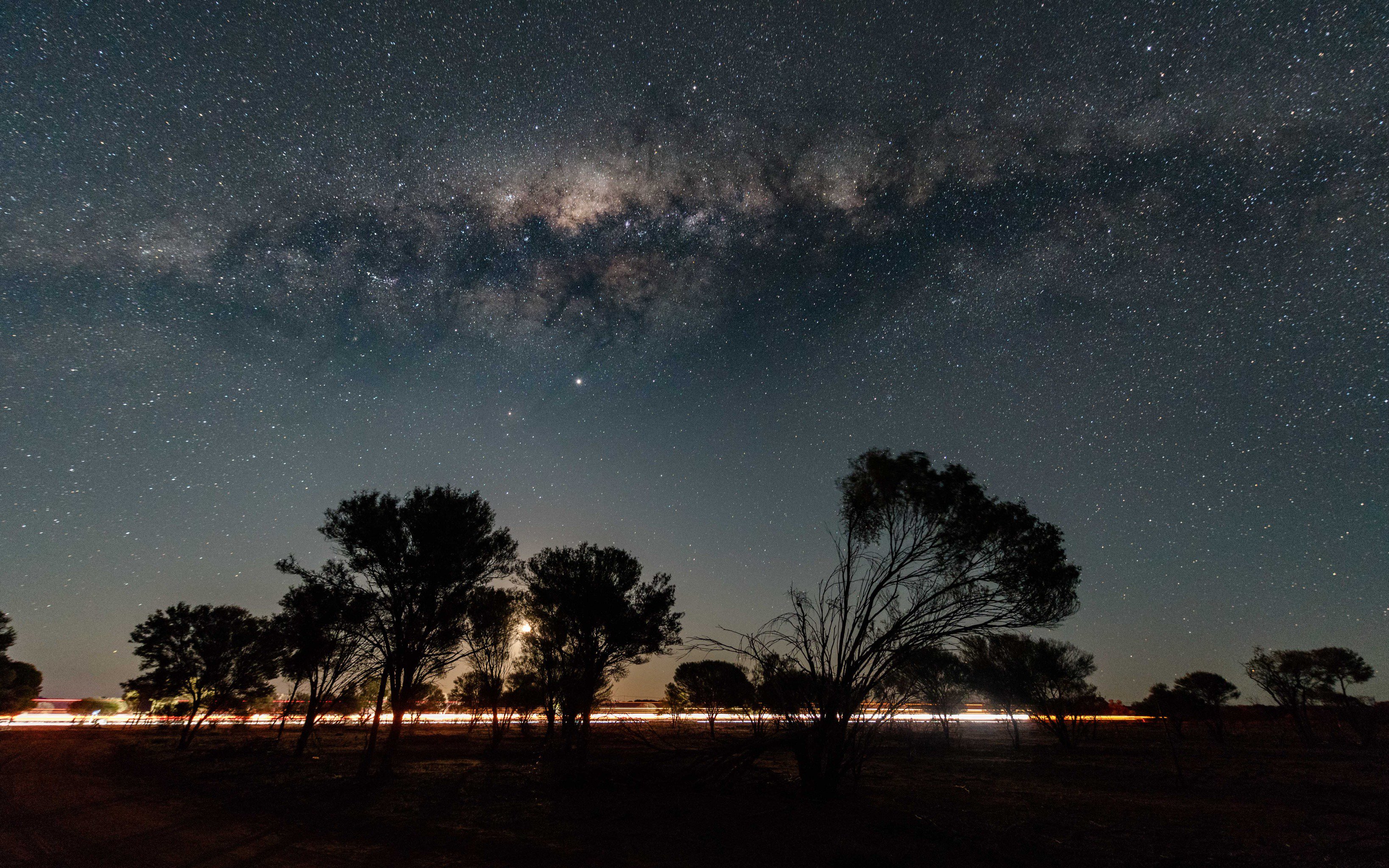 3rd Place Outback Western Australia as the Milky Way displays above a full, setting moon by Judy Leitch @leitchbird