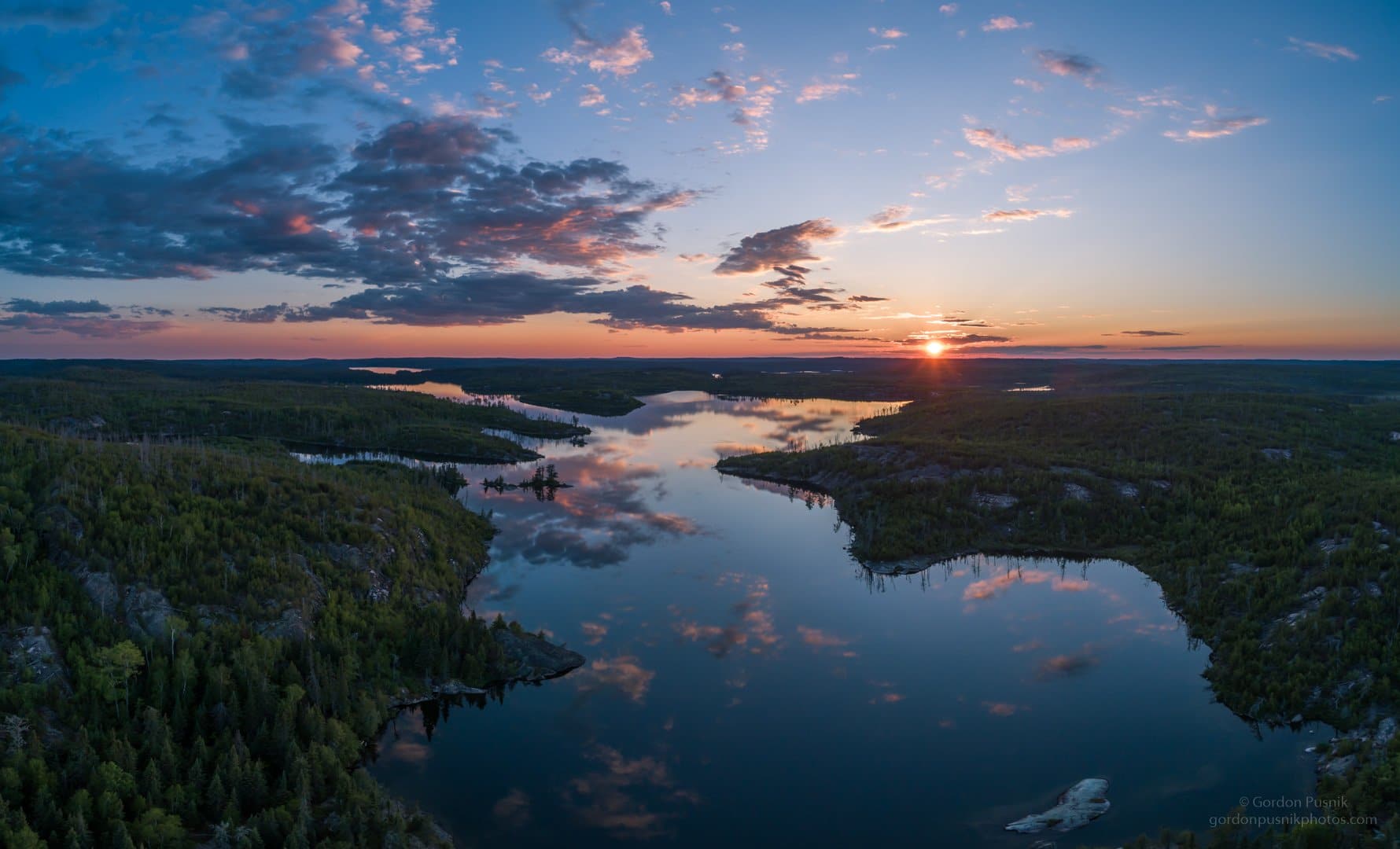 Sunset on a flat calm evening in N.W. Ontario by Gordon Pusnik @gordonpusnik