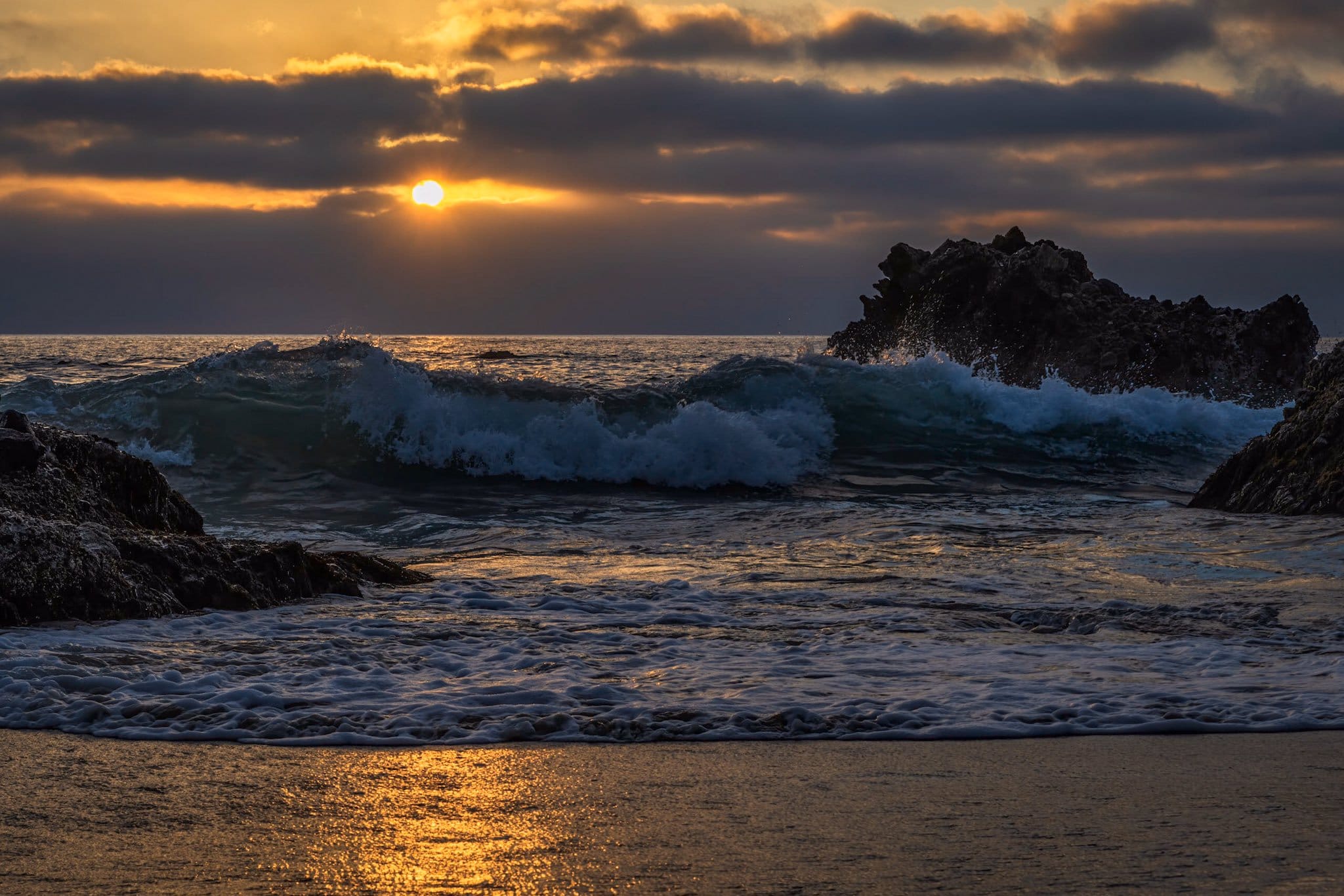 The sun trying to squeeze through the clouds at Laguna Beach, California by Michael Ryno Photo @mnryno34