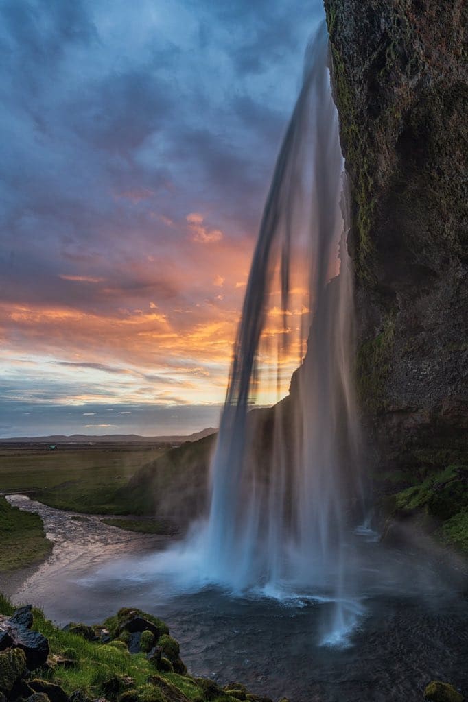 1st Place A sunrise photo from the back of Seljandsfoss in Iceland by Michael Ryno Photo @mnryno34