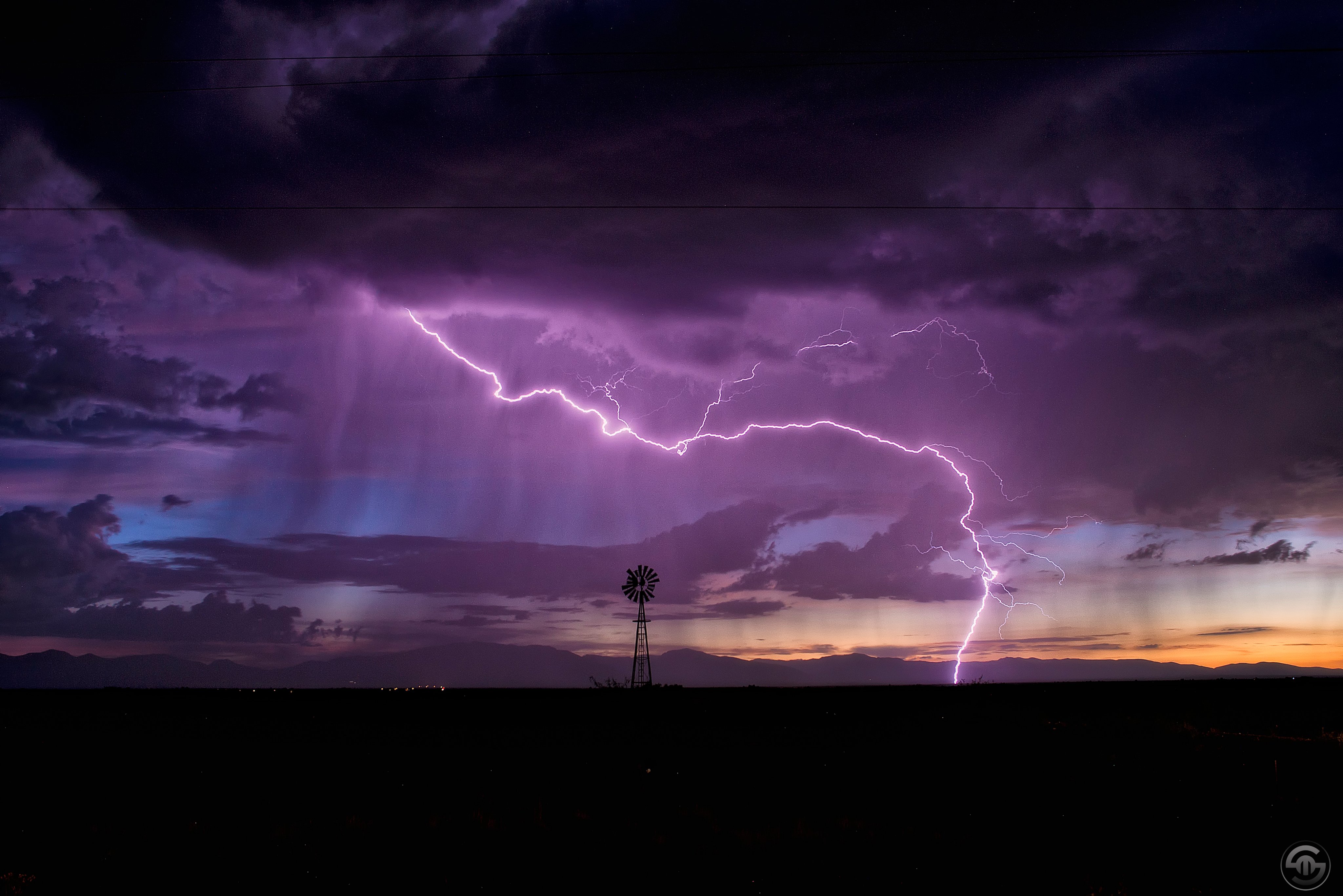 1st Place A sunset monsoon storm starts to fade as the sun sets behind the Mule Mountains in southeastern Arizona by Steven Maguire @StephenMaguire4