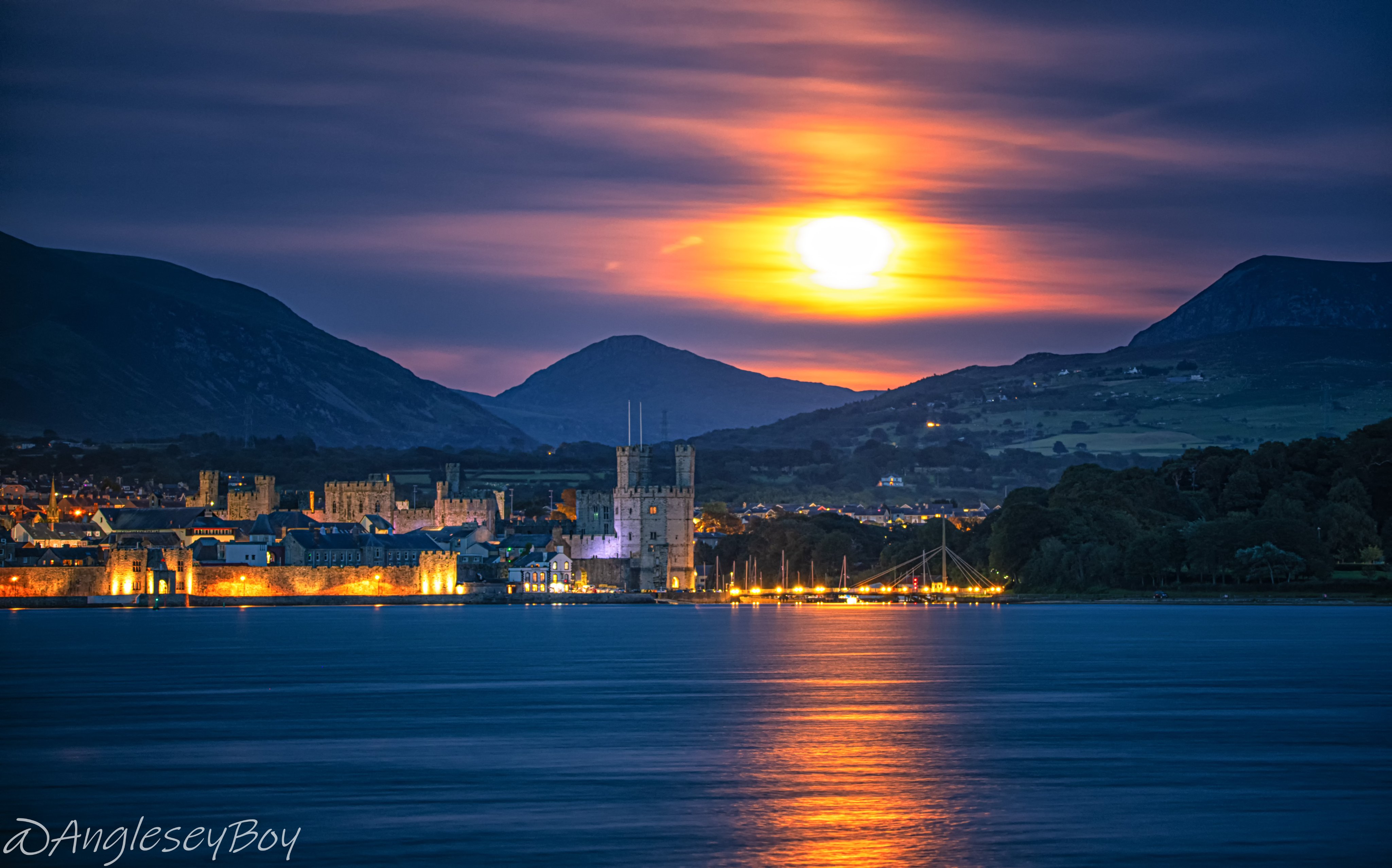 1st Place Sturgeon moon rising over Caernarfon Castle by Phil Taylor @angleseyboy