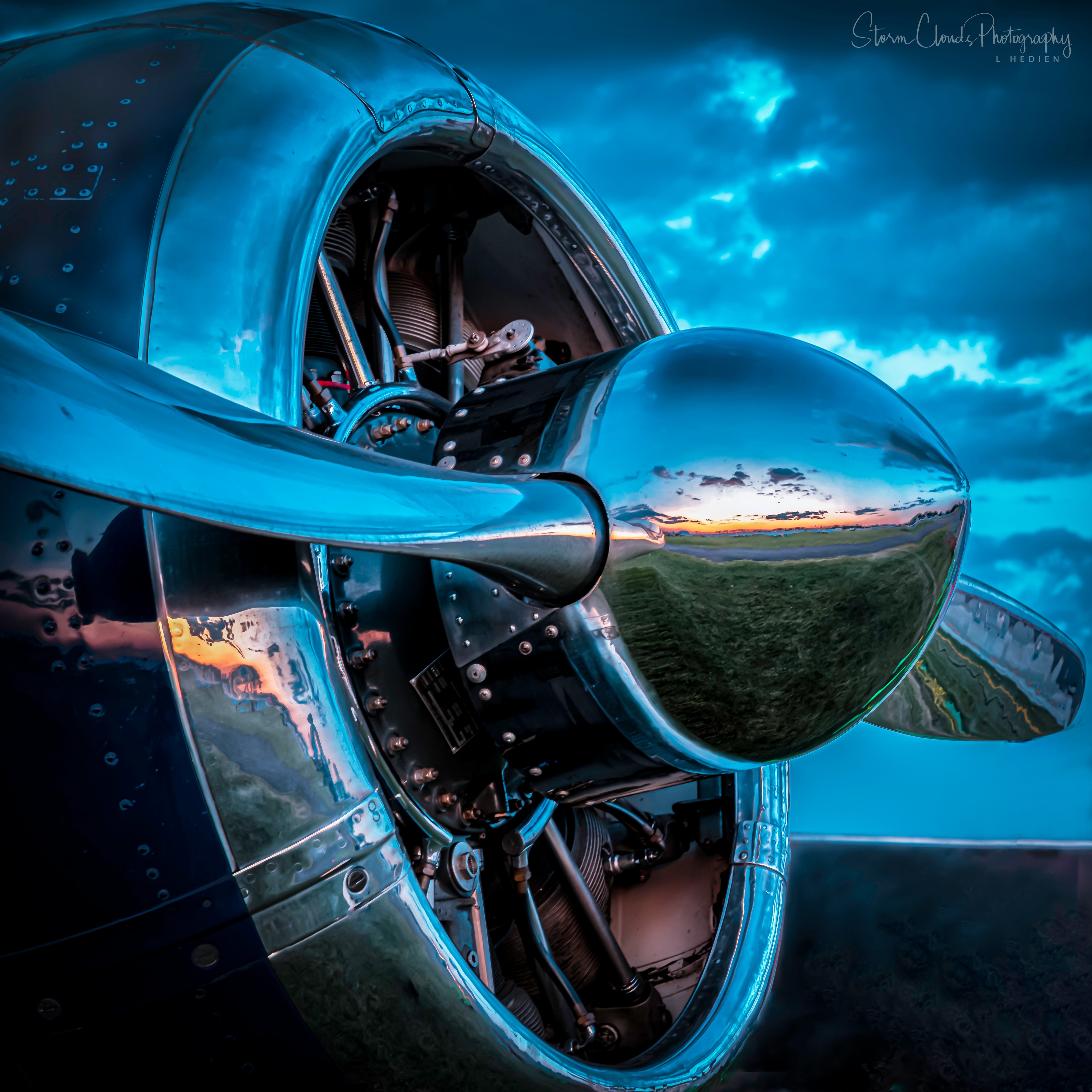 3rd Place Sunset reflection on the nose of a vintage aircraft by Laura Hedien @lhedien