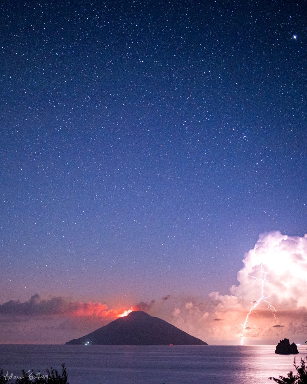 1st Place A terrific thunderstorm beside the erupting volcanic island of Stromboli, off Sicily by Adam Butler @adambutler65