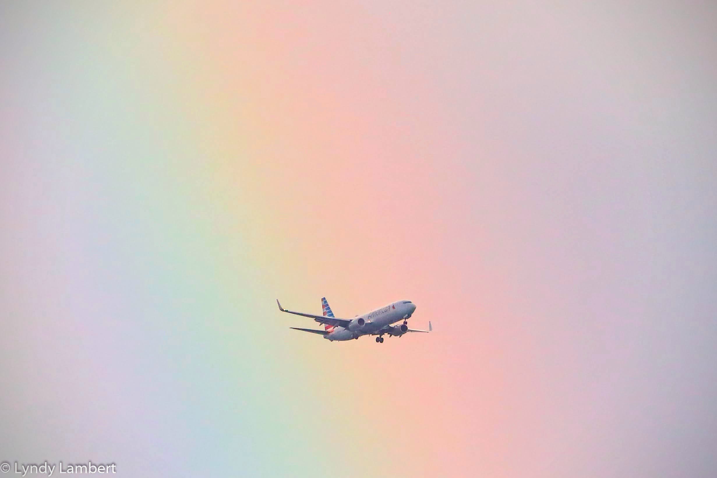 3rd Place Jet flying through a rainbow in Miami by Lyndall Lambert @LyndyMiami