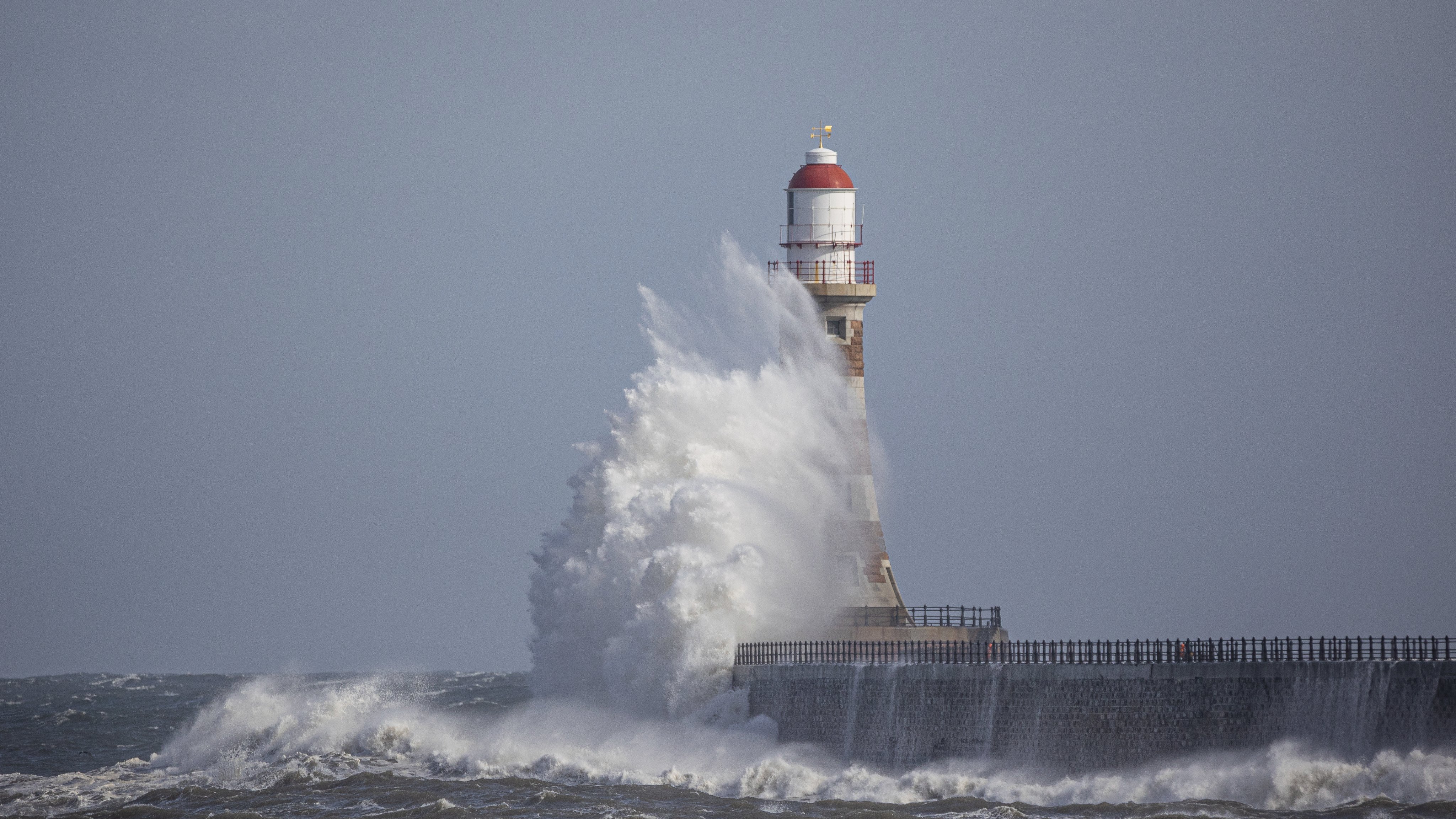 1st Place A beautiful wave hits Roker Lighthouse by simon c woodley @simoncwoodley