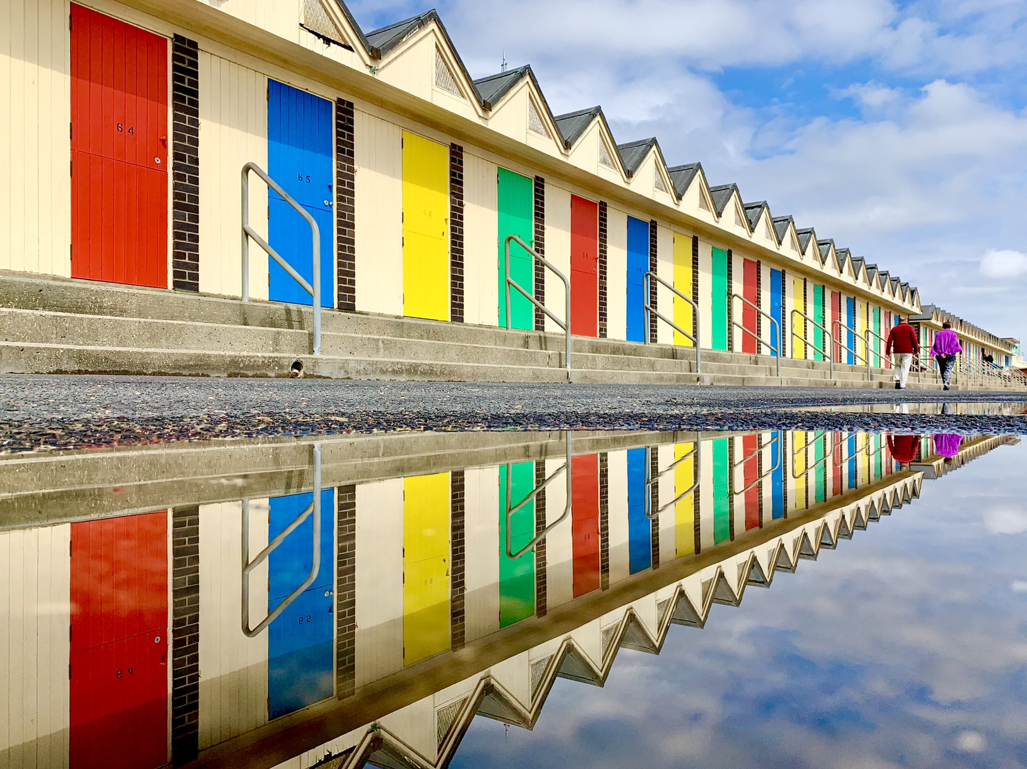 3rd Place Beach chalets reflected in the puddles at Kirkley, Suffolk by WalkingTractor @TractorWalking